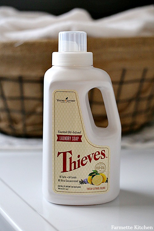 Bottle of Young Living Thieves Laundry Soap on washing machine