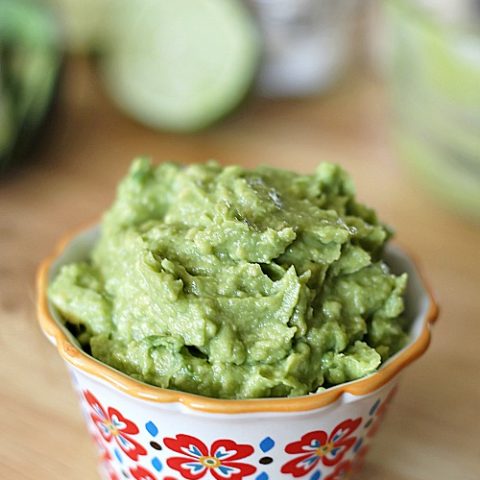 Transform avocados into the perfect, easy guacamole with only a little fresh lime juice, garlic powder, and salt.  This no-frills guacamole recipe is one that I go back to over and over again.  Perfect with chips or added to a burger!