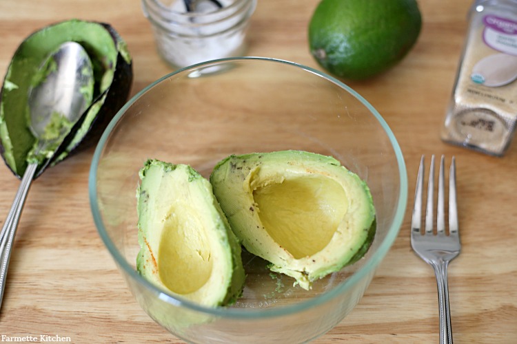 halved avocados in a bowl