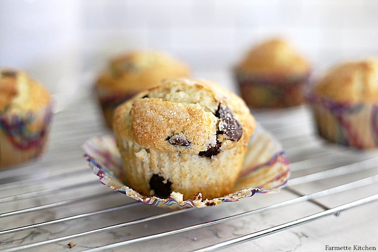 muffin with the liner pulled down on a wire rack