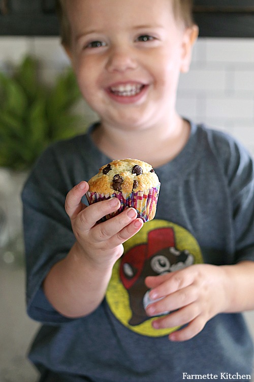 toddler holding small batch chocolate chip muffin