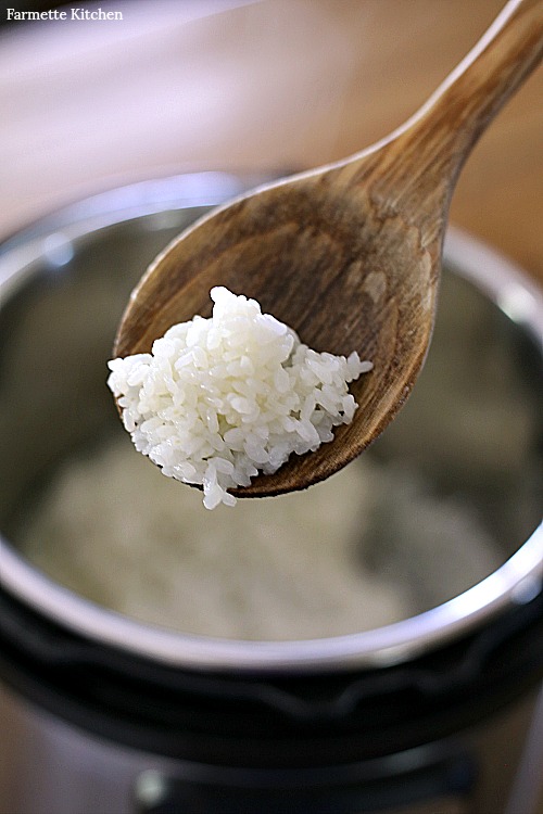 Hands cooking sticky rice with pot and rice steamer, traditional