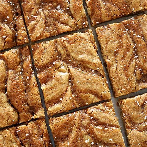 close up of salted caramel blondies cut into uniform squares