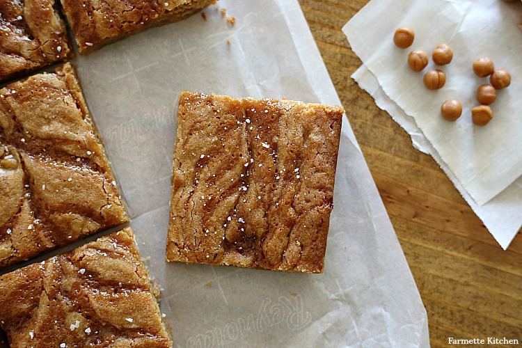 one square salted caramel blondie on parchment paper