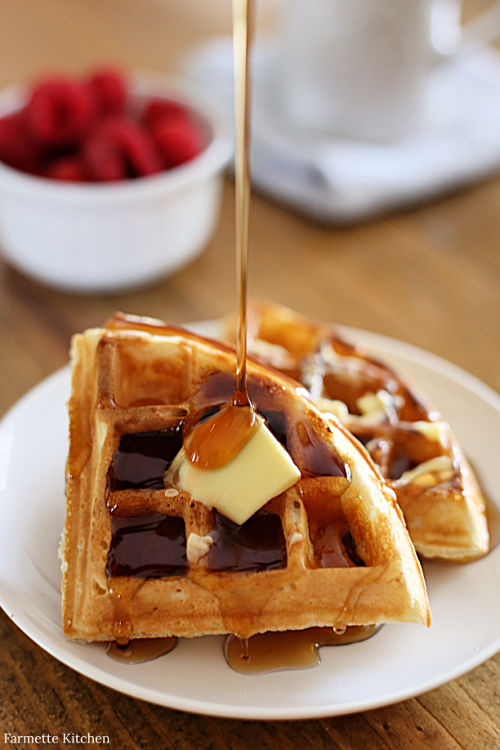 waffle triangles on a plate with butter and syrup