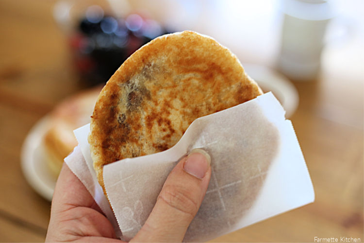 a Korean street food pancake wrapped in parchment paper