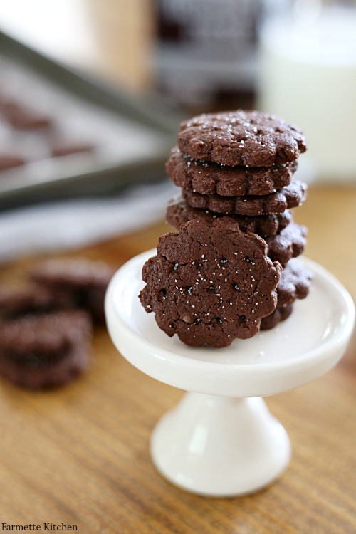 Chocolate Graham Crackers stacked together on a small white stand