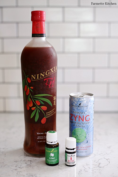 bottle of NingXia Red, NingXia Zyng, lime essential oil, and Red Shot essential oil