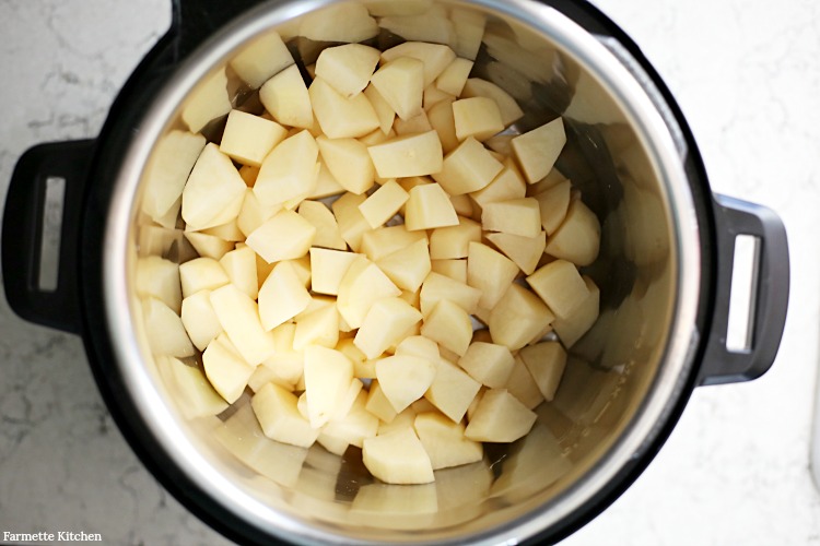 uncooked, diced, white potatoes in an electric pressure cooker