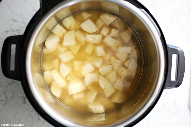 cooked potatoes in broth in an electric pressure cooker