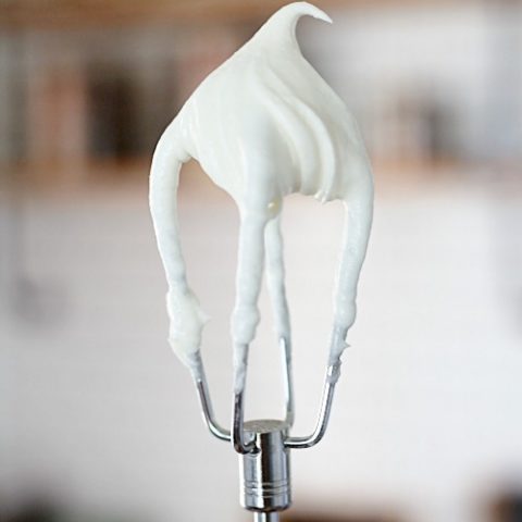cream cheese frosting on a mixing beater