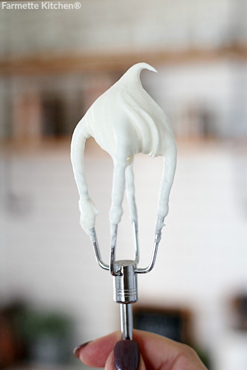 cream cheese frosting on a mixing beater