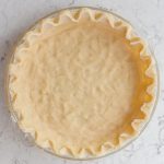 an unbaked all butter pie crust sitting on the counter