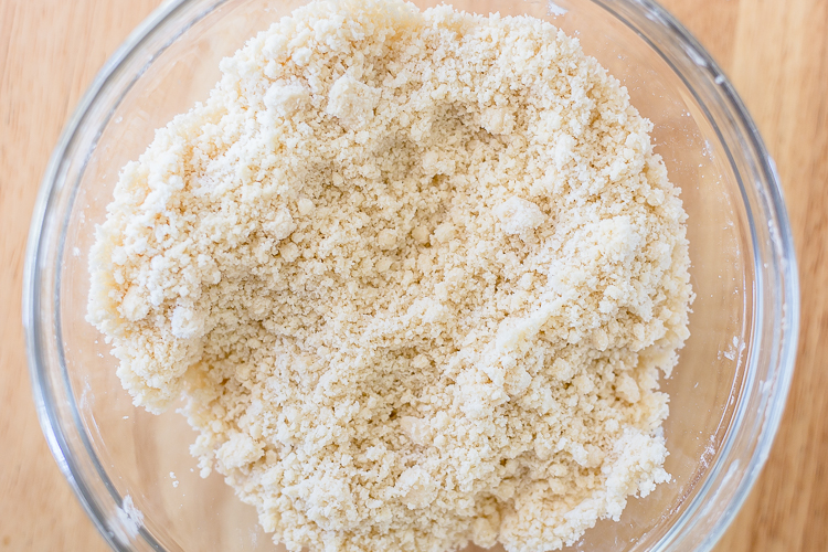 flour and butter crumbs in a glass bowl