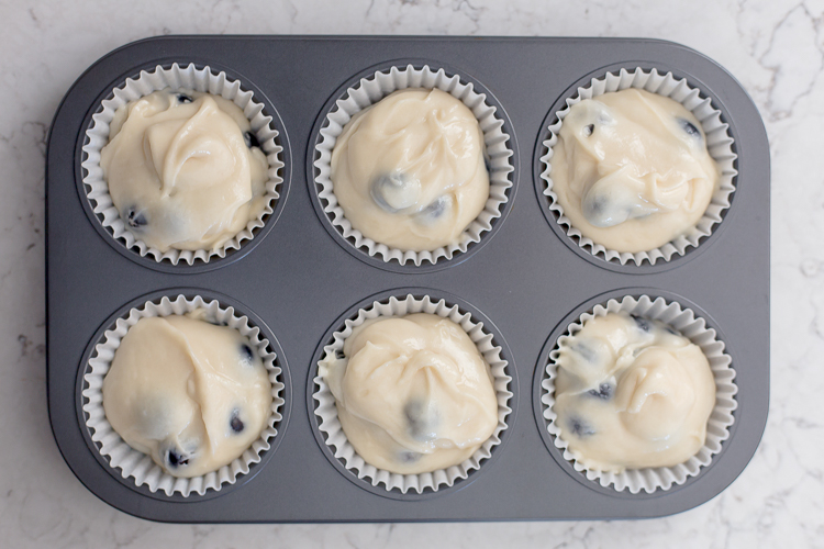 unbaked muffins in a muffin tin