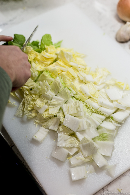 cutting napa cabbage into chunks