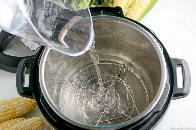 pouring water into a pressure cooker