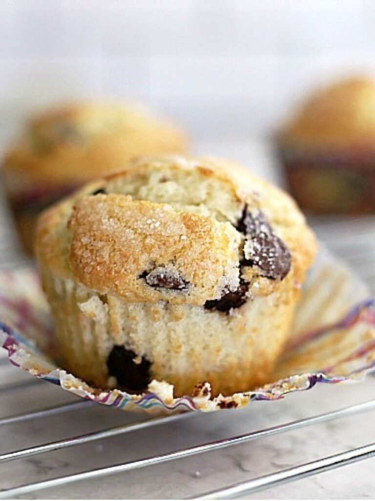 chocolate chip muffin with the paper liner peeled down