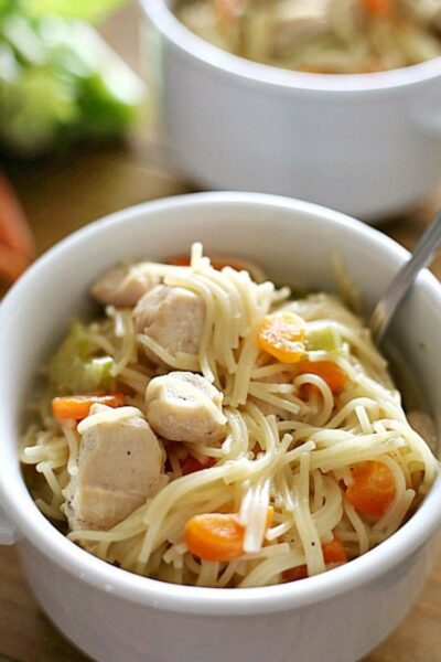 chicken noodle soup in a white bowl