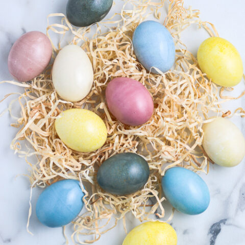 Natural Dyed Eggs on top of tan Easter grass