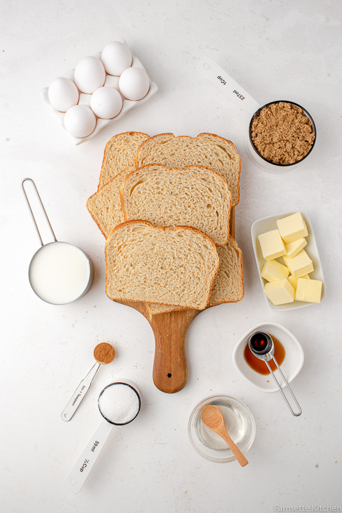 bread, eggs, butter, and other ingredients on a flat surface